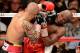 LAS VEGAS, NV - MAY 05: Miguel Cotto (L) hits Floyd Mayweather Jr. during the ninth round of their WBA super welterweight title fight at the MGM Grand Garden Arena May 5, 2012 in Las Vegas, Nevada. Mayweather won by unanimous decision. (Photo by Ethan Miller/Getty Images)