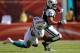 MIAMI GARDENS, FL - JANUARY 01: Tight end Dustin Keller #81 of the New York Jets is brought down by Linebacker Kevin Burnett #56 of the Miami Dolphins at Sun Life Stadium on January 1, 2012 in Miami Gardens, Florida. (Photo by Marc Serota/Getty Images)