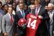 WASHINGTON, DC - APRIL 19: U.S. President Barack Obama (3rd L) poses for a group picture with members of the University of Alabama Crimson Tide, including coach Nick Saban (2nd L), quarterback A.J. McCarron (L), and offensive lineman Barrett Jones (4th L)during a South Lawn event at the White House April 19, 2012 in Washington, DC. Obama hosted the BCS national champion to honor their win over the Louisiana State University Tigers. (Photo by Alex Wong/Getty Images)