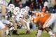 CHARLOTTE, NC - DECEMBER 03: Center Andrew Miller #74, guard Michael Via #67, and tackle Blake DeChristopher #62 of the Virginia Tech Hokies prepare for the snap during the ACC Championship game against the Clemson Tigers at Bank of America Stadium on December 3, 2011 in Charlotte, North Carolina. (Photo by Jared C. Tilton/Getty Images)