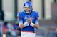 BOISE, ID - NOVEMBER 26: Kellen Moore #11 of the Boise State Broncos applauds a touchdown against the Wyoming Cowboys at Bronco Stadium on November 26, 2011 in Boise, Idaho. (Photo by Otto Kitsinger III/Getty Images)