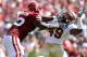 NORMAN, OK - SEPTEMBER 11: Offensive lineman Donald Stephenson #59 of the Oklahoma Sooners grabs the facemask of Brandon Jenkins #49 of the Florida State Seminoles at Gaylord Family Oklahoma Memorial Stadium on September 11, 2010 in Norman, Oklahoma. (Photo by Ronald Martinez/Getty Images)