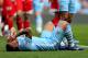 MANCHESTER, ENGLAND - MAY 13: Carlos Tevez of Manchester City lies on the pitch after being fouled by Joey Barton of QPR during the Barclays Premier League match between Manchester City and Queens Park Rangers at the Etihad Stadium on May 13, 2012 in Manchester, England. (Photo by Alex Livesey/Getty Images)