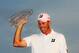 PONTE VEDRA BEACH, FL - MAY 13: Matt Kuchar of the United States celebrates with the trophy after his two-stroke victory during the final round to win THE PLAYERS Championship held at THE PLAYERS Stadium course at TPC Sawgrass on May 13, 2012 in Ponte Vedra Beach, Florida. (Photo by Sam Greenwood/Getty Images)