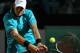 ROME, ITALY - MAY 14: John Isner of the USA plays a backhand against Philipp Kohlschreiber of Germany in their first round match during day three of the Internazionali BNL d'Italia 2012 at the Foro Italico Tennis Centre on May 14, 2012 in Rome, Italy. (Photo by Clive Brunskill/Getty Images)