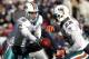 FOXBORO, MA - DECEMBER 24: Matt Moore #8 of the Miami Dolphins hands the ball off to Reggie Bush #22 during the first quarter against the New England Patriots at Gillette Stadium on December 24, 2011 in Foxboro, Massachusetts. (Photo by Winslow Townson/Getty Images)