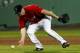 FORT MYERS, FL - MARCH 09: Infielder Kevin Youkilis #20 of the Boston Red Sox cannot come up with this ground ball against the Pittsburgh Pirates during a Grapefruit League Spring Training Game at JetBlue Park on March 9, 2012 in Fort Myers, Florida. (Photo by J. Meric/Getty Images)