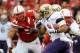 LINCOLN, NE - SEPTEMBER 17: Chris Polk #1 of the Washington Huskies runs past Jared Crick #94 and the rest of the Nebraska Cornhuskers defense during their game at Memorial Stadium September 17, 2011 in Lincoln, Nebraska. Nebraska won 51-38.(Photo by Eric Francis/Getty Images)