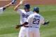 LOS ANGELES, CA - MAY 13: A.J. Ellis #17, James Loney #7, and Bobby Abreu #23 of the Los Angeles Dodgers celebrate after they score on Ellis' three run home run in the fifth inning against the Colorado Rockies on May 13, 2012 at Dodger Stadium in Los Angeles, California. (Photo by Stephen Dunn/Getty Images)