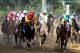 LOUISVILLE, KY - MAY 05: Bodemeister ridden by Mike Smith leads the field during the 138th running of the Kentucky Derby at Churchill Downs on May 5, 2012 in Louisville, Kentucky. (Photo by Elsa/Getty Images)