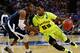 ATLANTA, GA - MARCH 23: Tu Holloway #52 of the Xavier Musketeers fouls Pierre Jackson #55 of the Baylor Bears during the 2012 NCAA Men's Basketball South Regional Semifinal game at the Georgia Dome on March 23, 2012 in Atlanta, Georgia. (Photo by Kevin C. Cox/Getty Images)