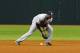 ST. PETERSBURG, FL - APRIL 7: Infielder Eduardo Nunez #26 of the New York Yankees bobbles an infield hit for an error against the Tampa Bay Rays April 7, 2012 at Tropicana Field in St. Petersburg, Florida. (Photo by Al Messerschmidt/Getty Images)