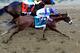 BALTIMORE, MD - MAY 19: I'll Have Another #9 ridden by Mario Gutierrez beats Bodemeister #7 ridden by Mike E. Smith at the finish line to win the 137th running of the Preakness Stakes at Pimlico Race Course on May 19, 2012 in Baltimore, Maryland. (Photo by Patrick Smith/Getty Images)