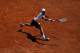 PARIS, FRANCE - MAY 25: Novak Djokovic of Serbia stretches to hit a backhand during a practice session ahead of the French Open at Roland Garros on May 25, 2012 in Paris, France. (Photo by Dan Istitene/Getty Images)