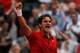 PARIS, FRANCE - JUNE 03: Roger Federer of Switzerland celebrates match point during the men's singles semi final match between Roger Federer of Switzerland and Novak Djokovic of Serbia on day thirteen of the French Open at Roland Garros on June 3, 2011 in Paris, France. (Photo by Matthew Stockman/Getty Images)