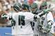 FOXBORO, MA - MAY 26: Eric Lusby #12 of Loyola Greyhounds (C) is congratulated by teammates after scoring against the Notre Dame Fighting Irish during the first half of a semifinal game of the 2012 NCAA Division I Men's Lacrosse Championships at Gillette Stadium on May 26, 2012 in Foxboro, Massachusetts. (Photo by Winslow Townson/Getty Images)