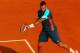 PARIS, FRANCE - MAY 27: Jo-Wilfried Tsonga of France plays a backhand during the men's singles first round match between Andrey Kuznetsov of Russia and Jo-Wilfried Tsonga of France on day one of the French Open at Roland Garros on May 27, 2012 in Paris, France. (Photo by Clive Brunskill/Getty Images)