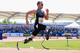 MANCHESTER, ENGLAND - MAY 22: Oscar Pistorius of South Africa on his way to victory in the men's T42/43/44 200m during day one of the BT Paralympic World Cup at Sportcity on May 22, 2012 in Manchester, England. (Photo by Michael Steele/Getty Images)