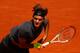 PARIS, FRANCE - MAY 28: Roger Federer of Switzerland serves in the men's singles first round match between Roger Federer of Switzerland and Tobias Kamke of Germany during day two of the French Open at Roland Garros on May 28, 2012 in Paris, France. (Photo by Clive Brunskill/Getty Images)