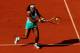 PARIS, FRANCE - MAY 29: Serena Williams of USA plays a backhand in her women's singles first round match between Serena Williams of USA and Virginie Razzano of France during day three of the French Open at Roland Garros on May 29, 2012 in Paris, France. (Photo by Mike Hewitt/Getty Images)