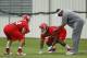 KANSAS CITY, MO - MAY 13: Ethan Johnson #70 and Dontari Poe #92 of the Kansas City Chiefs work with defensive coach Anthony Pleasant during the Kansas City Chiefs minicamp on May 13, 2012 at the Chiefs Training Facility in Kansas City, Missouri. (Photo by Kyle Rivas/Getty Images)