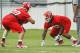 KANSAS CITY, MO - May 13: Ethan Johnson #70 and Dontari Poe #92 of the Kansas City Chiefs work with defensive coach Anthony Pleasant during the Kansas City Chiefs Minicamp on May 13, 2012 at the Chiefs Training Facility in Kansas City, Missouri. (Photo by Kyle Rivas/Getty Images)