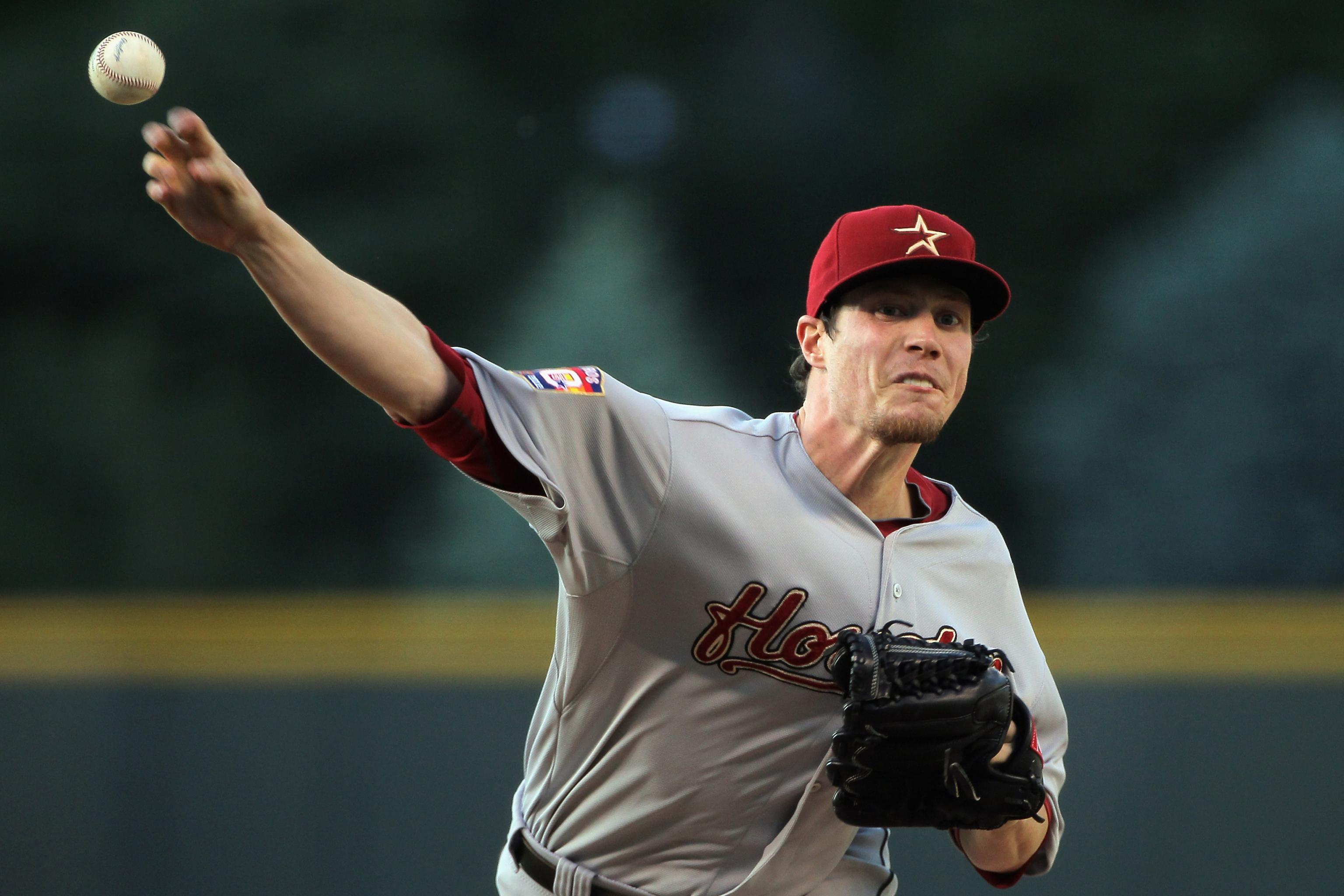 Houston Astros starting pitcher Lucas Harrell receives a new ball