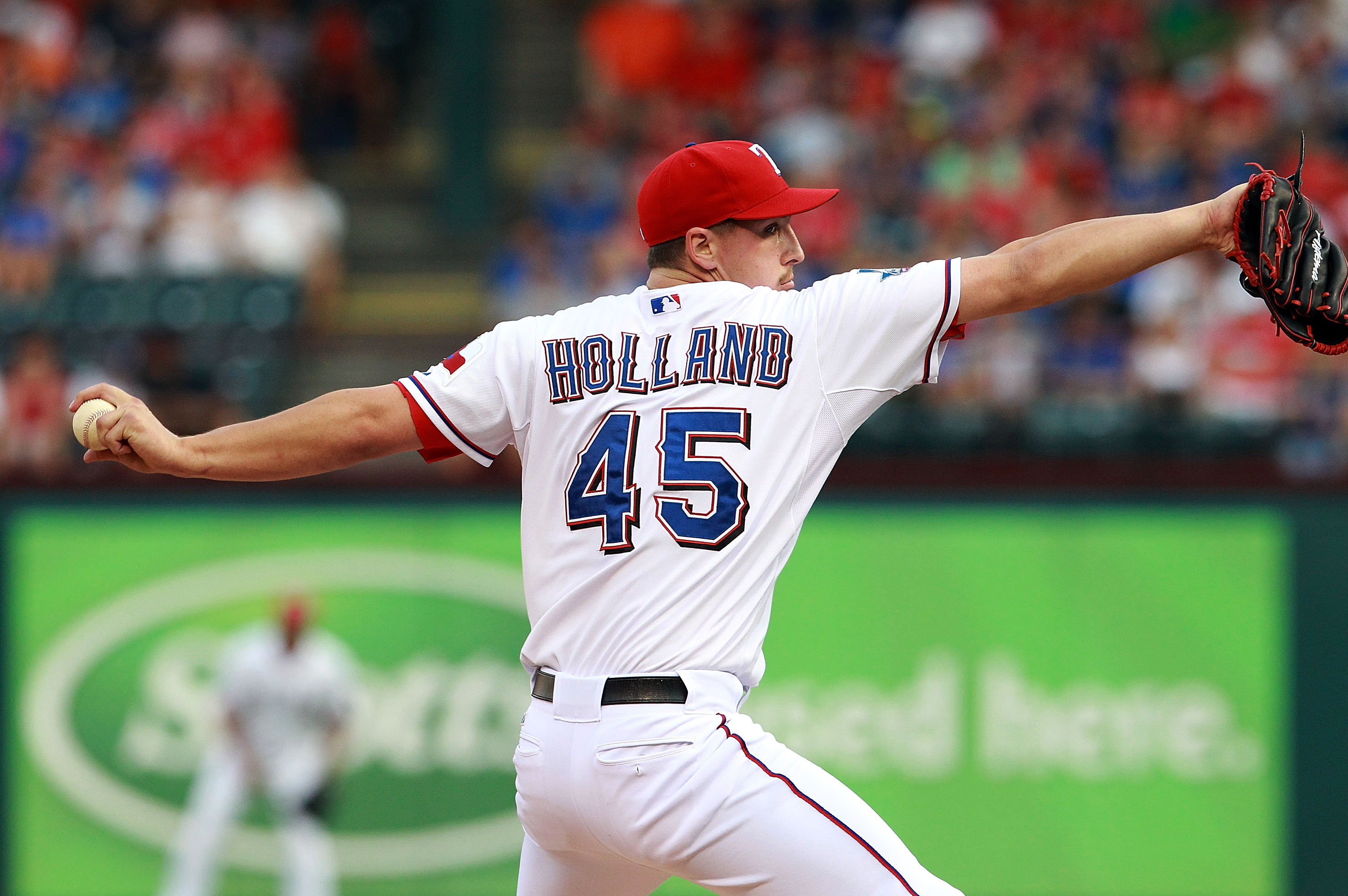 Texas Rangers' Derek Holland is sporting a 'Wild Thing' haircut