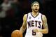 NEWARK, NJ - APRIL 10: Deron Williams #8 of the New Jersey Nets brings the ball up court in the second half against the Philadelphia 76ers at Prudential Center on April 10, 2012 in Newark, New Jersey. NOTE TO USER: User expressly acknowledges and agrees that, by downloading and or using this photograph, User is consenting to the terms and conditions of the Getty Images License Agreement. (Photo by Chris Chambers/Getty Images)
