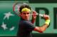 PARIS, FRANCE - JUNE 01: Roger Federer of Switzerland plays a backhand during his men's singles third round match against Nicolas Mahut of France during day six of the French Open at Roland Garros on June 1, 2012 in Paris, France. (Photo by Mike Hewitt/Getty Images)