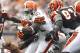 CLEVELAND, OH - SEPTEMBER 11: Montario Hardesty #31 of the Cleveland Browns runs the ball by defensive end Robert Geathers #91 of the Cincinnati Bengals during the season opener at Cleveland Browns Stadium on September 11, 2011 in Cleveland, Ohio. (Photo by Matt Sullivan/Getty Images)