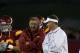 LOS ANGELES, CA - SEPTEMBER 11: Head coach Lane Kiffin (R) and his father and defensive coordinator Monte Kiffin of the USC Trojans talk during warmups for their game with the Virginia Cavaliers at Los Angeles Memorial Coliseum on September 11, 2010 in Los Angeles, California. (Photo by Stephen Dunn/Getty Images)