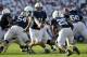 STATE COLLEGE, PA - SEPTEMBER 10: Quarterback Matthew McGloin #11 of the Penn State Nittany Lions hands the ball off to running back Silas Redd #25 during the first half against the Alabama Crimson Tigers at Beaver Stadium on September 10, 2011 in State College, Pennsylvania. (Photo by Rob Carr/Getty Images)