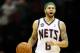 NEWARK, NJ - APRIL 10: Deron Williams #8 of the New Jersey Nets brings the ball up court in the second half against the Philadelphia 76ers at Prudential Center on April 10, 2012 in Newark, New Jersey. NOTE TO USER: User expressly acknowledges and agrees that, by downloading and or using this photograph, User is consenting to the terms and conditions of the Getty Images License Agreement. (Photo by Chris Chambers/Getty Images)