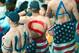DAEJEON, SOUTH KOREA - JUNE 14 : Fans of the U.S. soccer team cheer with American flags and body paintings during the U.S. versus Poland game at the 2002 World Cup at Daejeon Stadium June 14, 2002 in Daejeon, South Korea. (Photo by Chung Sung-Jun/Getty Images)