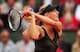 PARIS, FRANCE - JUNE 06: Maria Sharapova of Russia plays a backhand in her women's singles quarter final match against Kaia Kanepi of Estonia during day 11 of the French Open at Roland Garros on June 6, 2012 in Paris, France. (Photo by Mike Hewitt/Getty Images)