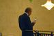 Denver Broncos owner Pat Bowlen checks his cell phone at an NFL owners meeting in suburban Chicago August 8, 2006. The owners named Roger Goodell to succeed retiring commissioner Paul Tagliabue. (Photo by Al Messerschmidt/Getty Images)