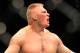 LAS VEGAS - JULY 11: Brock Lesnar reacts after knocking out Frank Mir during their heavyweight title bout during UFC 100 on July 11, 2009 in Las Vegas, Nevada. (Photo by Jon Kopaloff/Getty Images)