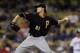 LOS ANGELES, CA - SEPTEMBER 16: Jeff Locke #61 of the Pittsburgh Pirates throws a pitch against the Los Angeles Dodgers on September 16, 2011 at Dodger Stadium in Los Angeles, California. (Photo by Stephen Dunn/Getty Images)