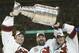 EAST RUTHERFORD, NJ - JUNE 9: (L-R) Goalie Martin Brodeur #30, Ken Daneyko #3 and Patrik Elias #26 of the New Jersey Devils hold up the Stanley Cup after defeating the Mighty Ducks of Anaheim 3-0 in game seven of the 2003 Stanley Cup Finals at Continental Airlines Arena on June 9, 2003 in East Rutherford, New Jersey. The Devils defeated the Ducks 3-0. (Photo by Elsa/Getty Images/NHLI)