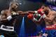 LAS VEGAS, NV - JUNE 09: (L-R) Timothy Bradley lands a left to the head of Manny Pacquiao during their WBO welterweight title fight at MGM Grand Garden Arena on June 9, 2012 in Las Vegas, Nevada. (Photo by Kevork Djansezian/Getty Images)