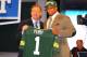 NEW YORK, NY - APRIL 26: Nick Perry (R) from USC holds up a jersey as he stands on stage with NFL Commissioner Roger Goodell after he was selected #28 overall by the Green Bay Packers in the first round of the 2012 NFL Draft at Radio City Music Hall on April 26, 2012 in New York City. (Photo by Al Bello/Getty Images)
