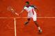 PARIS, FRANCE - JUNE 05: Jo-Wilfried Tsonga of France volleys in his men's singles quarter final match against Novak Djokovic of Serbia during day 10 of the French Open at Roland Garros on June 5, 2012 in Paris, France. (Photo by Clive Brunskill/Getty Images)