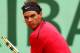 PARIS, FRANCE - JUNE 10: Rafael Nadal of Spain plays a backhand during the men's singles final against Novak Djokovic of Serbia on day 15 of the French Open at Roland Garros on June 10, 2012 in Paris, France. (Photo by Clive Brunskill/Getty Images)