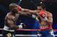 LAS VEGAS, NV - JUNE 09: (L-R) Timothy Bradley and Manny Pacquiao exchange punches during their WBO welterweight title fight at MGM Grand Garden Arena on June 9, 2012 in Las Vegas, Nevada. (Photo by Kevork Djansezian/Getty Images)