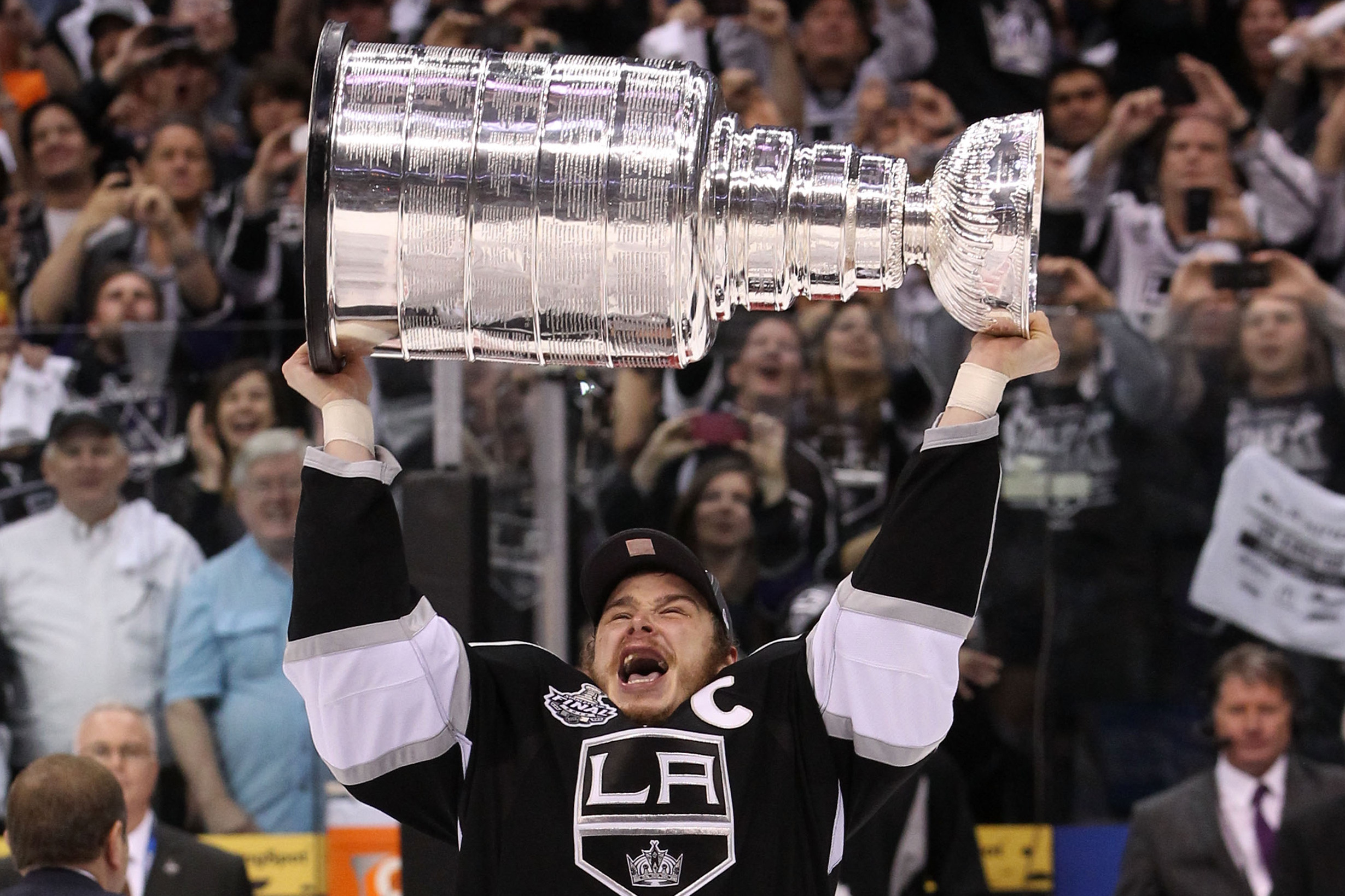 Dustin Brown with the Stanley Cup Trophy after Winning Game 6 of the 2012  Stanley Cup Finals Sports Photo