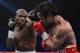 LAS VEGAS, NV - JUNE 09: (L-R) Timothy Bradley lands a left to the head of Manny Pacquiao during their WBO welterweight title fight at MGM Grand Garden Arena on June 9, 2012 in Las Vegas, Nevada. (Photo by Kevork Djansezian/Getty Images)