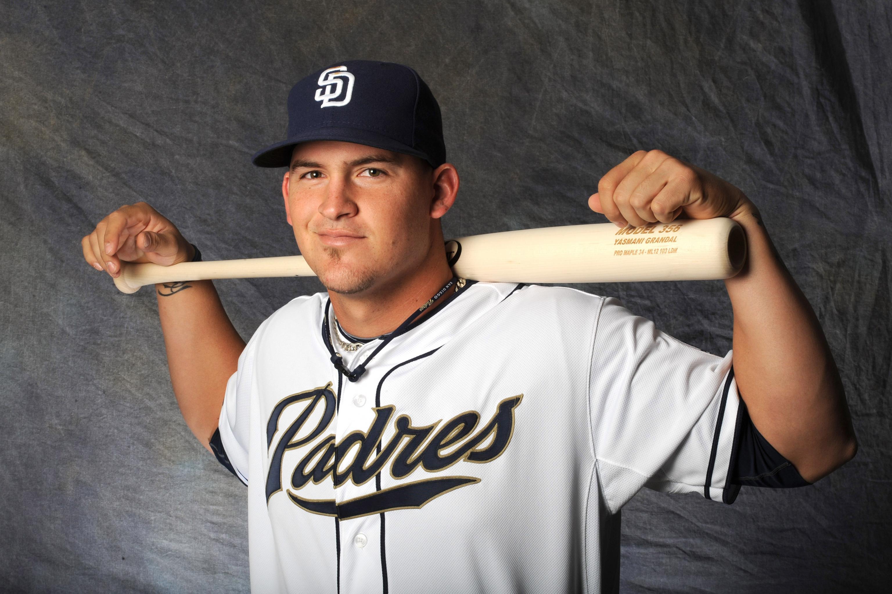 San Diego Padres catcher Yasmani Grandal gets loose before batting