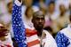 6 OCT 1992: USA BASKETBALL TEAM MEMBERS MICHAEL JORDAN (MIDDLE) SCOTTIE PIPPEN (LEFT) AND CLIDE DREXLER (RIGHT) ACKNOWLEDGE THE CROWD AFTER RECEIVING THEIR GOLD MEDALAS MEMBERS OF THE DREAM TEAM DURING THE 1992 BARCELONA OLYMPICS IN BARCELONA, SPAIN. Man