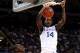 NEW ORLEANS, LA - MARCH 31: Michael Kidd-Gilchrist #14 of the Kentucky Wildcats dunks the ball next to Gorgui Dieng #10 of the Louisville Cardinals in the second half during the National Semifinal game of the 2012 NCAA Division I Men's Basketball Championship at the Mercedes-Benz Superdome on March 31, 2012 in New Orleans, Louisiana. (Photo by Ronald Martinez/Getty Images)
